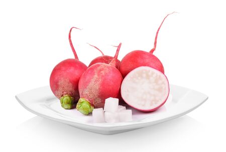 Small radish in white plate on white backgroundの写真素材