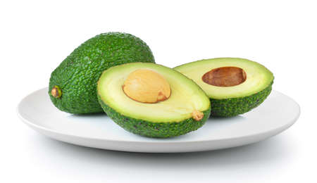 avocado in a plate isolated on a white backgroundの写真素材