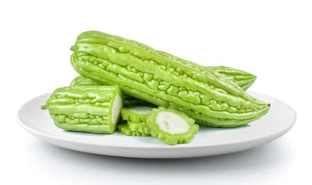 Bitter melon in plate isolated on a white backgroundの写真素材