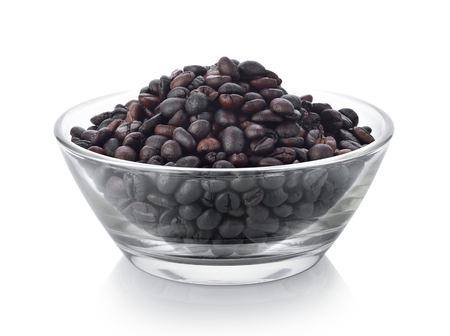 coffee seeds in a bowl on white backgroundの写真素材