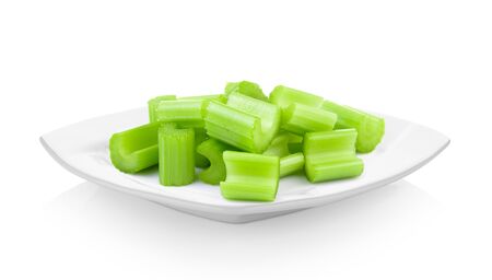 celery in ceramic white plate on white backgroundの写真素材