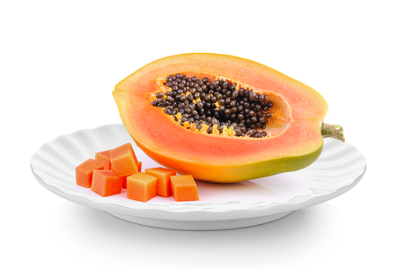 ripe papaya in a plate isolated on a white backgroundの写真素材