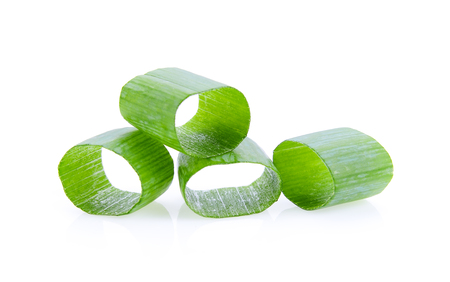 chopped green onions on white backgroundの写真素材