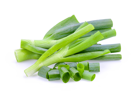 chopped green onions on white backgroundの写真素材