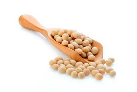 Soybean in wooden scoop isolated on white backgroundの写真素材