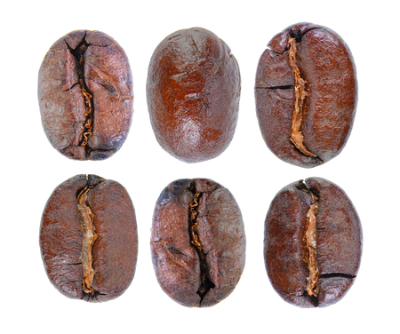 roasted coffee beans isolated in white backgroundの写真素材