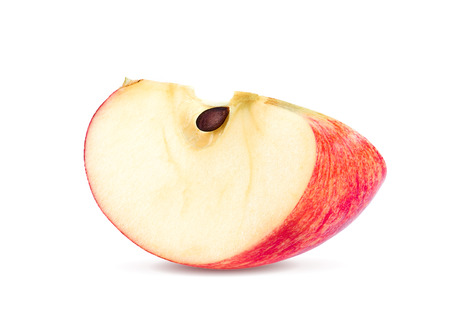 Red apple fruit slice (cut) isolated on white backgroundの写真素材