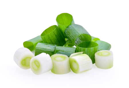chopped green onions on white backgroundの写真素材