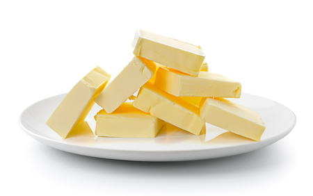 butter in a plate isolated on a white backgroundの写真素材