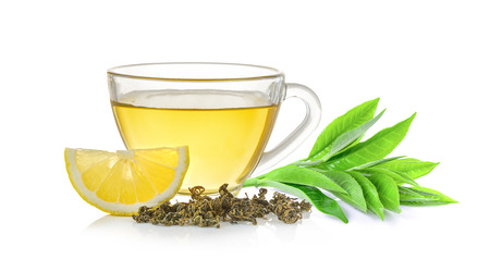 glass of tea and tea leaf on white backgroundの写真素材