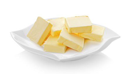 butter in ceramic plate (beautiful shape) on white backgroundの写真素材