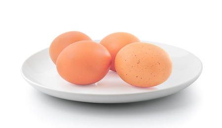 egg in a plate isolated on a white backgroundの写真素材