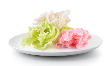 coconut with sugar thai dessert in a plate isolated on a white backgroundの写真素材