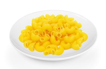 dry macaroni in a plate on white backgroundの写真素材