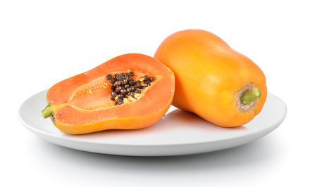 papaya in a plate isolated on a white backgroundの写真素材