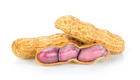 peanuts in closeup on white backgroundの写真素材