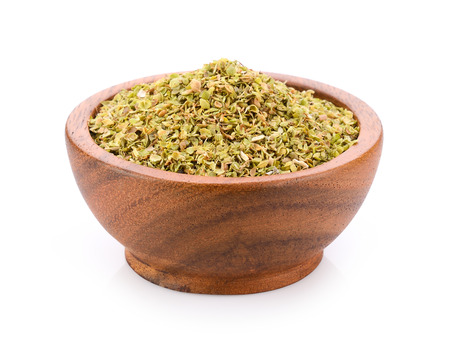 Oregano spice in wood bowl on white backgroundの写真素材