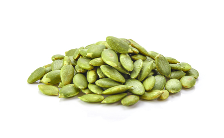 Pumpkin seeds on a white backgroundの写真素材