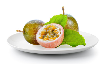 passionfruit in a plate isolated on a white backgroundの写真素材