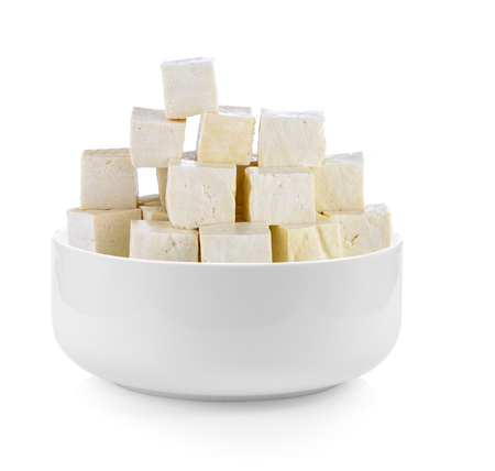 tofu in a bowl on white backgroundの写真素材