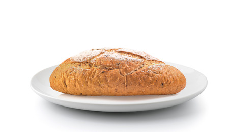 french round bread in a plate isolated on a white backgroundの写真素材