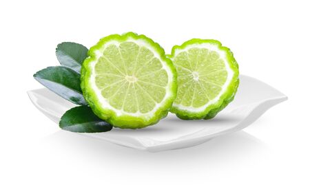 bergamot in ceramic plate (beautiful shape) on white backgroundの写真素材