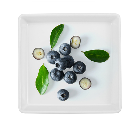 Blueberry collection in ceramic plate on white backgroundの写真素材