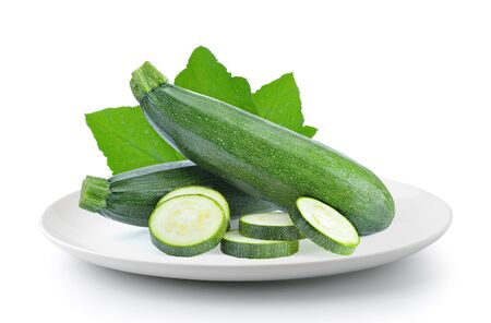 zucchini in a plate isolated on a white backgroundの写真素材