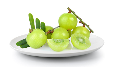 Indian gooseberry in a plate isolated on a white backgroundの写真素材