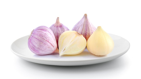 Elephant garlic in a plate isolated on a white backgroundの写真素材