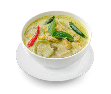 Thai food chicken green curry in the white bolw on white backgroundの写真素材