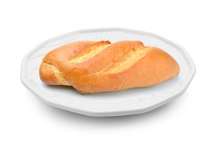 bread in a plate on white backgroundの写真素材