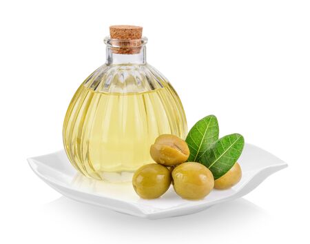 green olives and oil in plate (beautiful shape) on white backgroundの写真素材