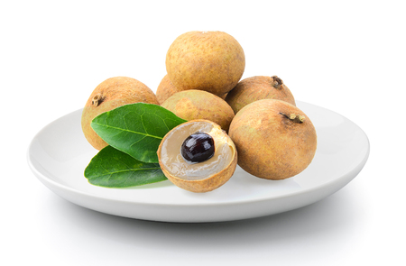 fresh longan in plate isolated on a white backgroundの写真素材