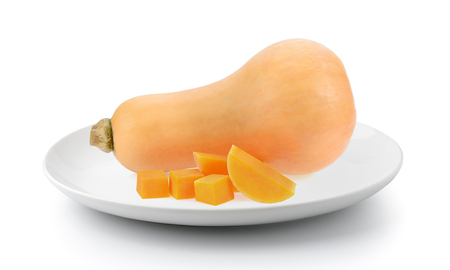 butternut squash in plate isolated on a white backgroundの写真素材
