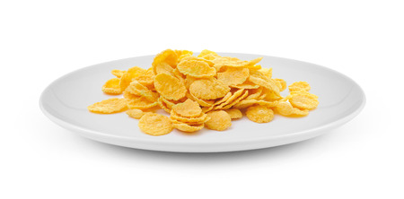 tasty cornflakes in plate isolated on white backgroundの写真素材
