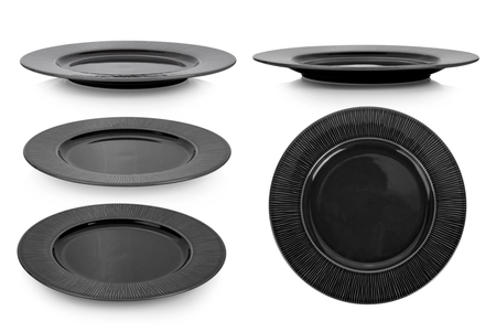ceramic black plate on white backgroundの写真素材