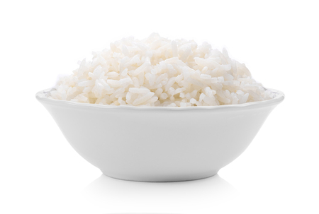 Cooked rice in ceramic bowl on white backgroundの写真素材