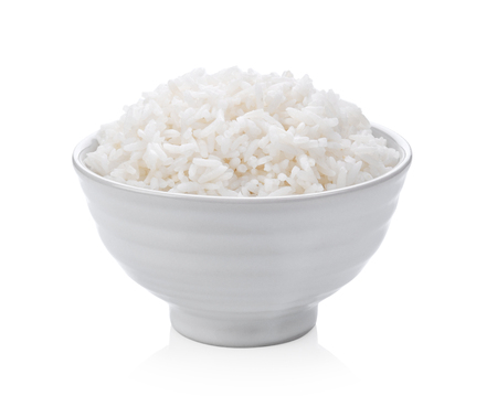 Cooked rice in ceramic bowl on white backgroundの写真素材