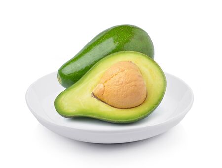 avocado in plate on white backgroundの写真素材