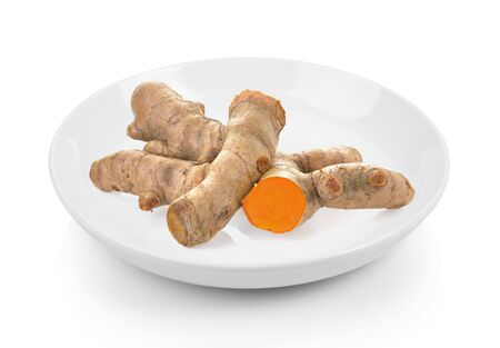 turmeric in plate on white backgroundの写真素材
