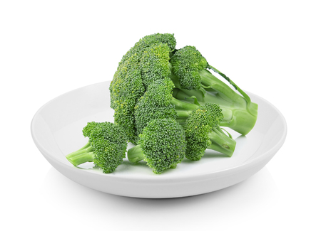 Broccoli in plate on white backgroundの写真素材