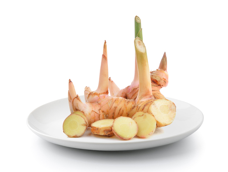galangal in plate isolated on a white backgroundの写真素材