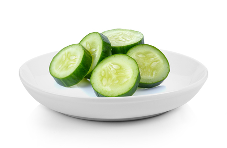 Cucumber slices in plate on white backgroundの写真素材