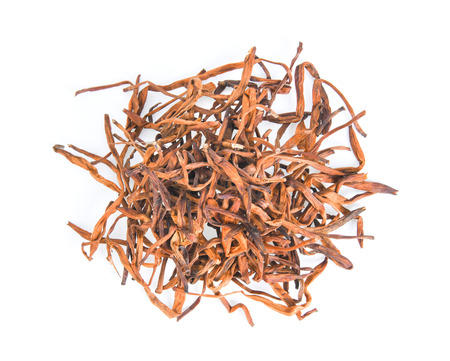 dried daylily flower on white backgroundの写真素材