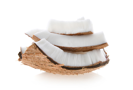 Coconut pieces isolated on a white backgroundの写真素材