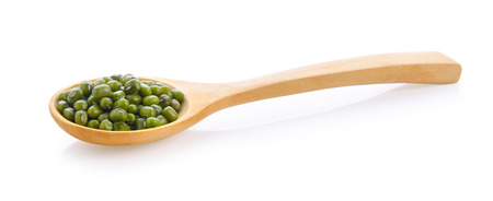 Green beans seeds in wood spoon on white backgroundの写真素材