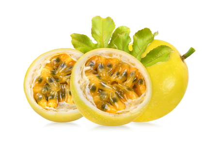 yellow passion fruit with leaf on white backgroundの写真素材