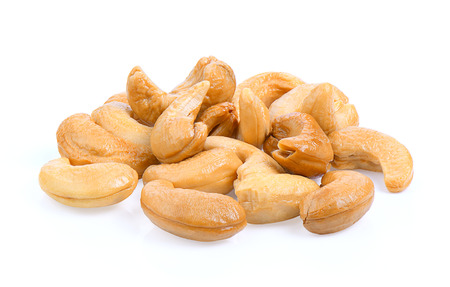 Roasted cashews isolated on a white backgroundの写真素材