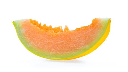 yellow honeydew melon slice isolated on white backgroundの写真素材